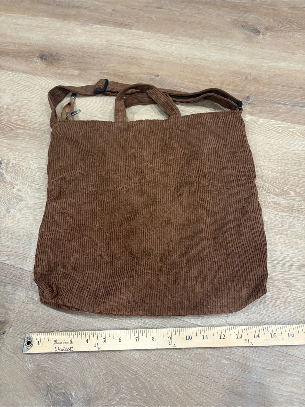 Urban Outfitters brown corduroy messenger tote with white logo